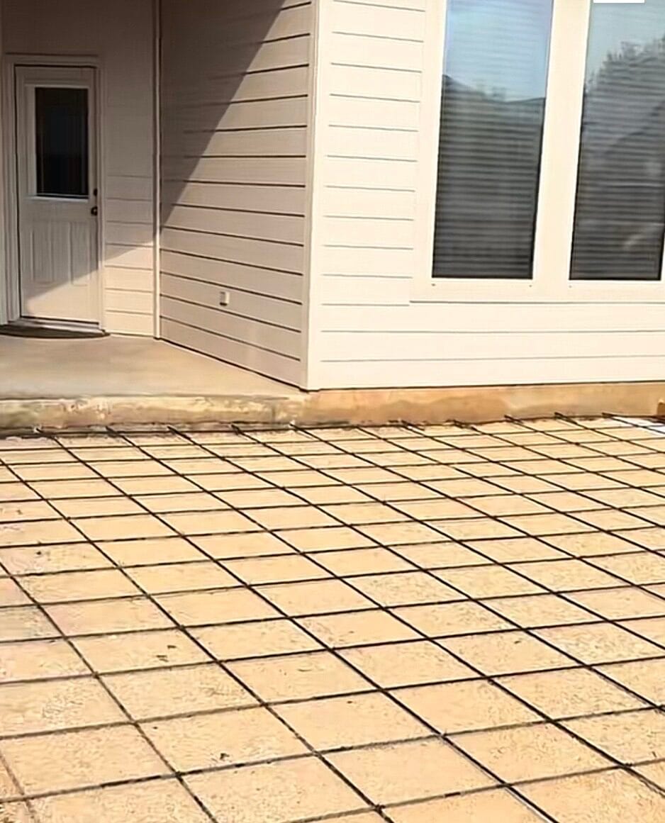 Rebar grid and wood forms set over a compacted base before the concrete driveway extension pour, Venus TX