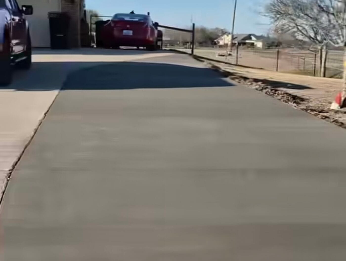 Smooth finished concrete patio extension tied into the existing patio slab, Waxahachie TX
