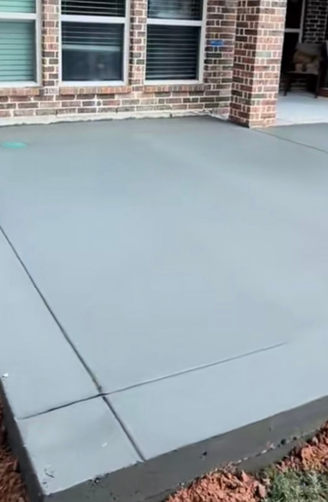 Concrete patio slab with clean control joints and a formed edge at a Waxahachie TX home