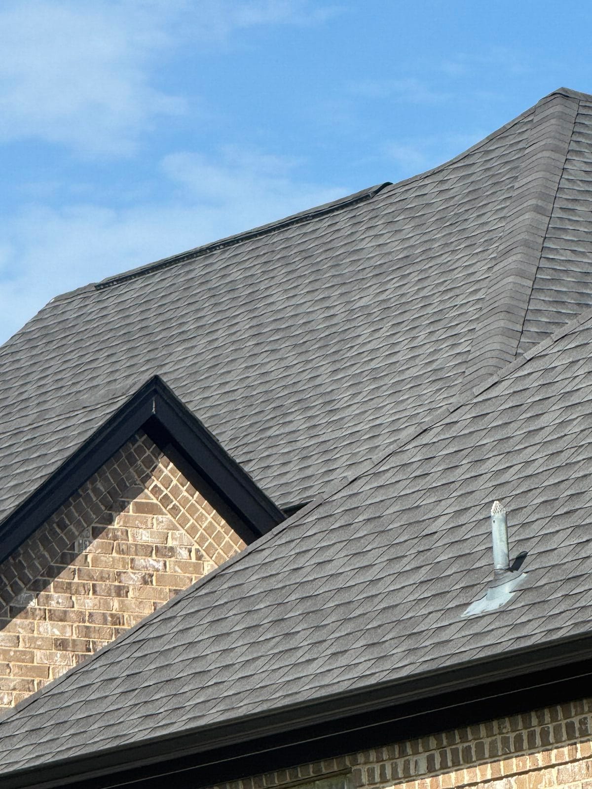 Fresh shingle roof with new vent boot